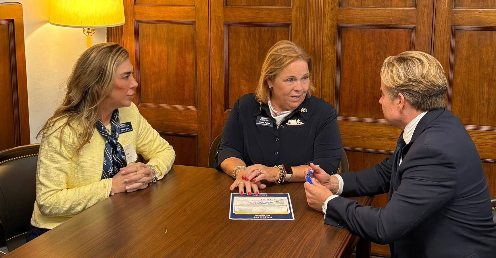 Congressman meeting with two female constituents