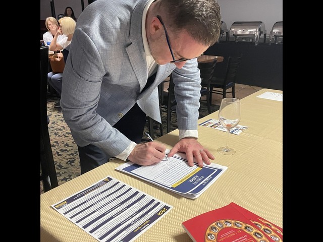 Dr. Poynton signs the Parent Pledge 2