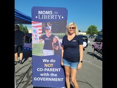 Clarissa with the Moms4Liberty Pop-up Banner