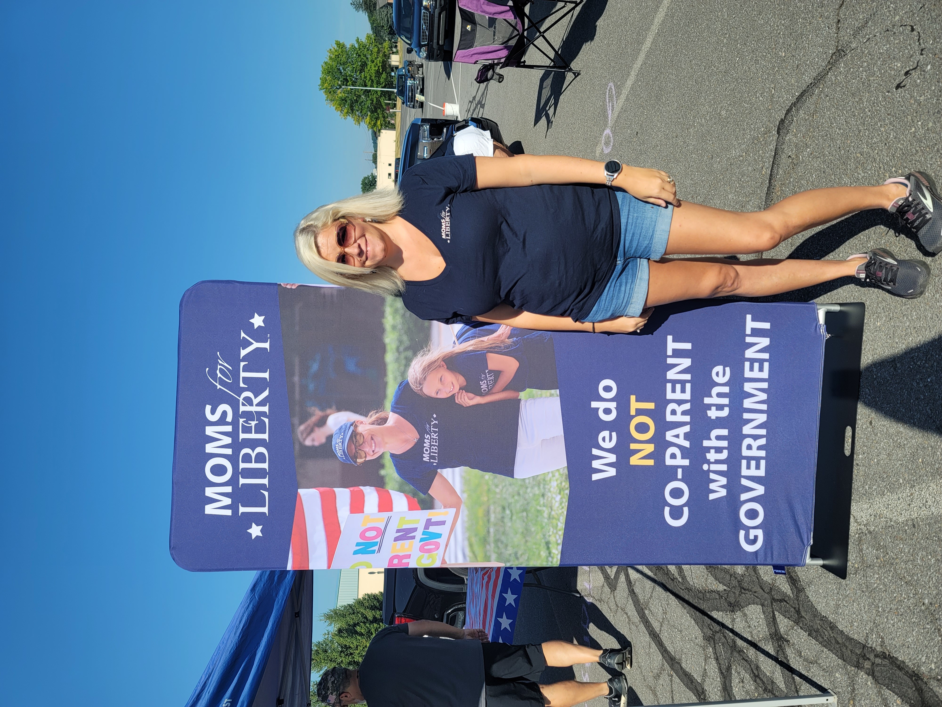 Clarissa with the Moms4Liberty Pop-up Banner