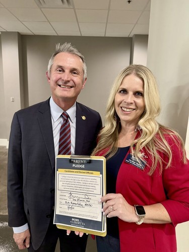 Representative Tom Oliverson with Christie Slape
