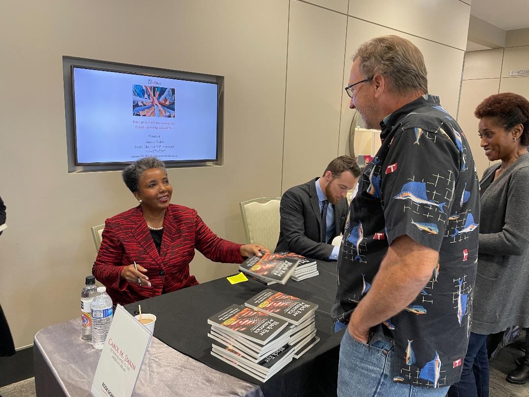 Hall County Chapter Treasurer, Mark Guilford meets with Dr. Carol Swain